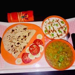 A picture of Cucumber Raita Green moong Dal.
