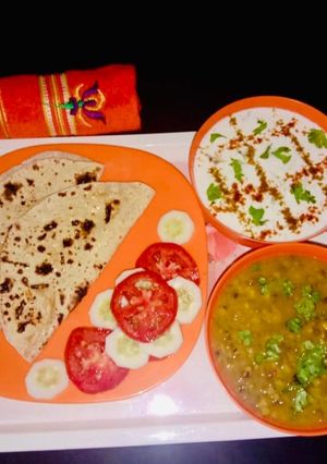 A picture of Cucumber Raita Green moong Dal.