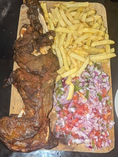A picture of Chevon maka with fried chips.