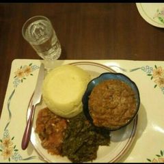 A picture of AfricanCake(Ugali)Sauted mushroomsKenyan greens by Seline.