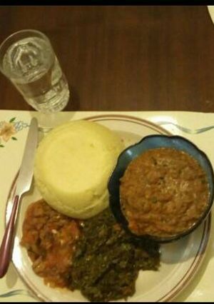 A picture of AfricanCake(Ugali)Sauted mushroomsKenyan greens by Seline.