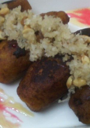 A picture of Cheese and peanuts stuffed banana pockets.