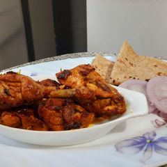 Fried chicken with rumali roti A picture of Fried chicken with rumali roti.
