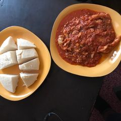 A picture of Marinated Stewed Fish and Ugali.