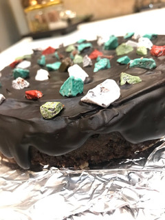 A picture of Chocolate ganache cake with chocolate stones#chocolate.