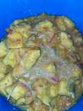 Peppered yam porridge with tiny fried fishes