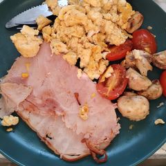 A picture of Small cooked breakfast. Scrambled eggs.