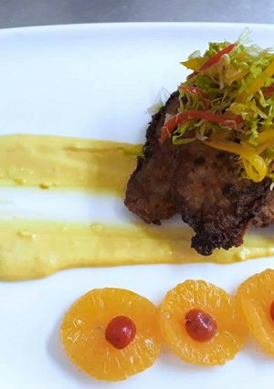 A picture of Pan Fried Fish with Maltaise Sauce.