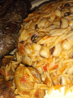 A picture of Jallof rice with beans.