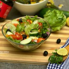 A picture of Cucumber, black olive and lettuce salad.