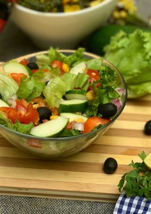 A picture of Cucumber, black olive and lettuce salad.