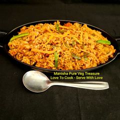 A picture of Veg Schezwan Fried Matta Red Rice.