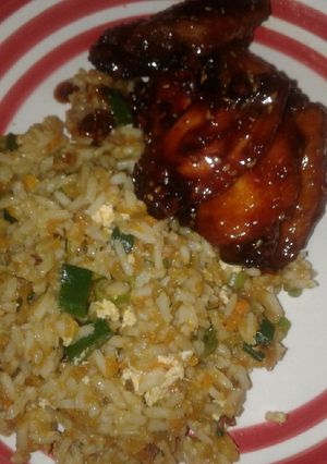 A picture of Honey soy chicken wings and fried rice.
