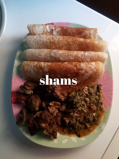 A picture of Rice pancake (Sinasir) wit vegetable soup and pepper soup.