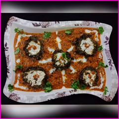 A picture of Shaam savera - Paneer stuffed Spinach koftas.