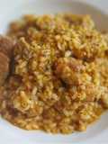 Arroz meloso mar y montaña de costillas y sofrito de sepia