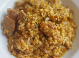 Foto principal de Arroz meloso mar y montaña de costillas y sofrito de sepia