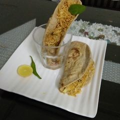 A picture of Whole wheat Tacos with leftover chana vegetable.