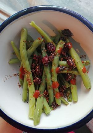 Una foto de Snack : Ejotes con arándanos