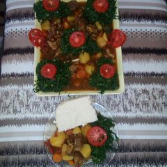 A picture of Ugali,  beef stew and steamed sukuma wiki.