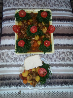 A picture of Ugali,  beef stew and steamed sukuma wiki.