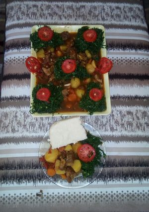 A picture of Ugali, beef stew and steamed sukuma wiki.
