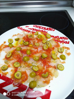 Una foto de Carpaccio de bacalao