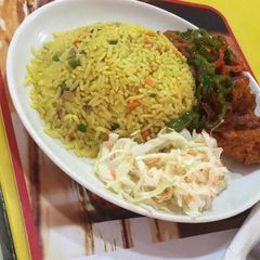 A picture of Fried rice with vegetables and chicken.