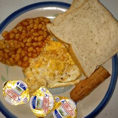 Oyibo breakfast (fried egg,bread, baked beans, sausage) A picture of Oyibo breakfast (fried egg,bread, baked beans, sausage).
