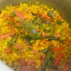 A picture of Dal masoor with red bell pepper.