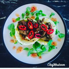 A picture of Sautéed Chilli Beef on Poached Cabbage Leaves.