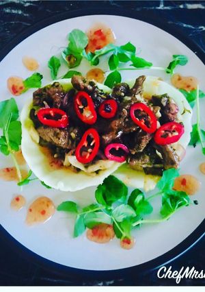 A picture of Sautéed Chilli Beef on Poached Cabbage Leaves.