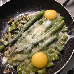 A picture of Asparagus and eggs.