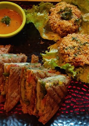 A picture of Double decker sandwich with Maggi bhel.