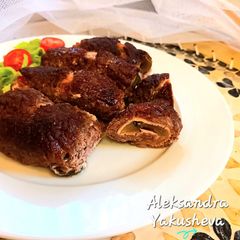 A picture of Beef rolls in the oven.