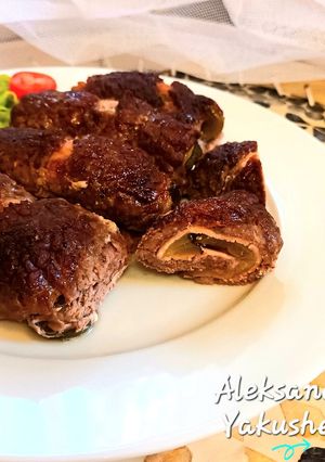 A picture of Beef rolls in the oven.