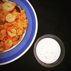 A picture of Spanish Paella with Aioli sauce.