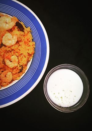 A picture of Spanish Paella with Aioli sauce.
