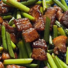 A picture of Stir-Fried Garlic Scapes with Pork Belly.