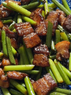 A picture of Stir-Fried Garlic Scapes with Pork Belly.