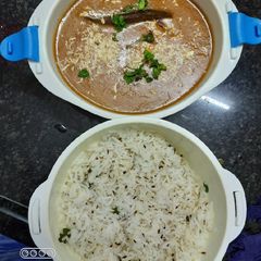A picture of Dal makhni and jeera rice.
