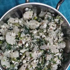 A picture of White moola and green leaves koshimbir.