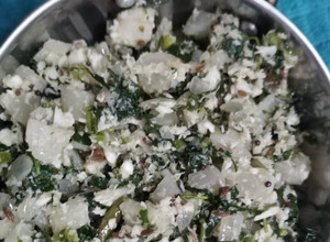 A picture of White moola and green leaves koshimbir.