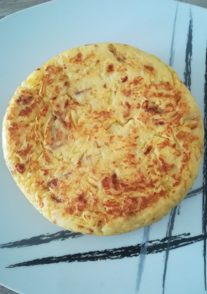 Una foto de Tortilla de patatas con cebolla