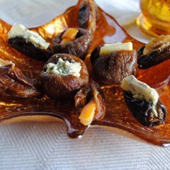 A picture of Stuffed figs and dates with cheese / nuts.