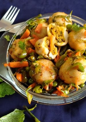 A picture of Stuffed Riceballs tossed in mix vegetables.