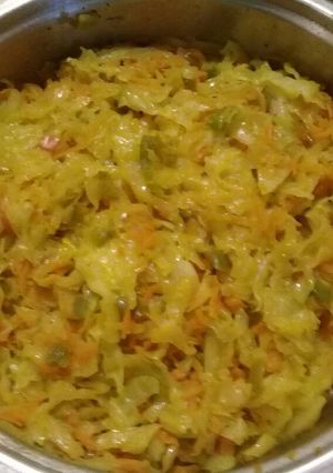A picture of Fried cabbage with carrots and peppers.