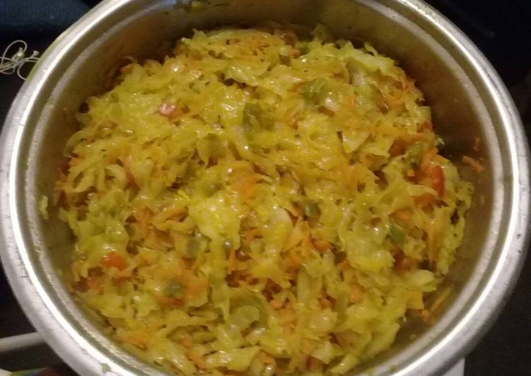 Fried cabbage with carrots and peppers
