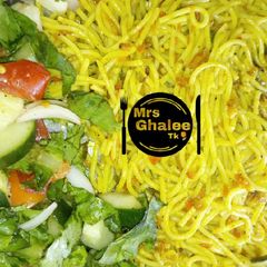 A picture of Jallof sphagetti with salad.