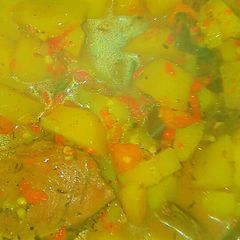 A picture of Potatoes, carrot and assorted meat soup.